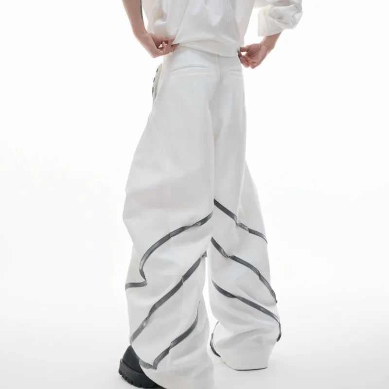 Men's polyester trousers with metal striped rivets and pleated detailing in black or white options