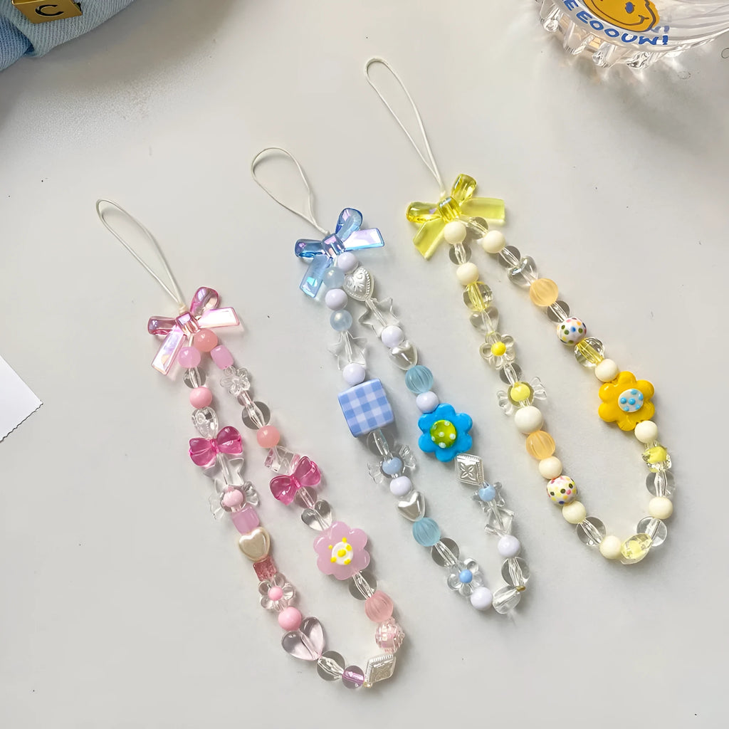Beaded flower mobile phone lanyard with plastic resin decorations in blue, pink or yellow colour options