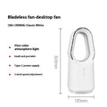 White SK bladeless tower floor fan with remote control on a wooden floor next to a desk.