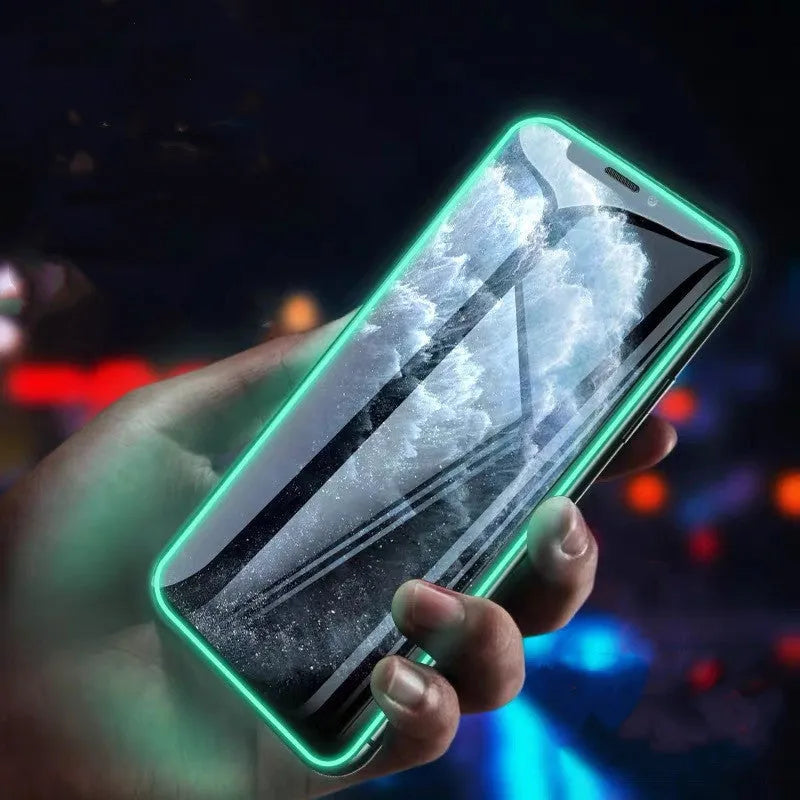 Luminous full cover tempered glass screen protector for iPhone glowing in dark with anti-scratch features.