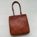 Brown handmade cowhide leather woven tote bag with three-dimensional pockets