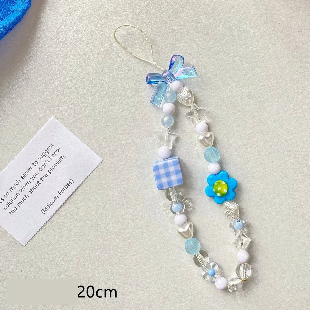 Beaded flower mobile phone lanyard with plastic resin decorations in blue, pink or yellow colour options