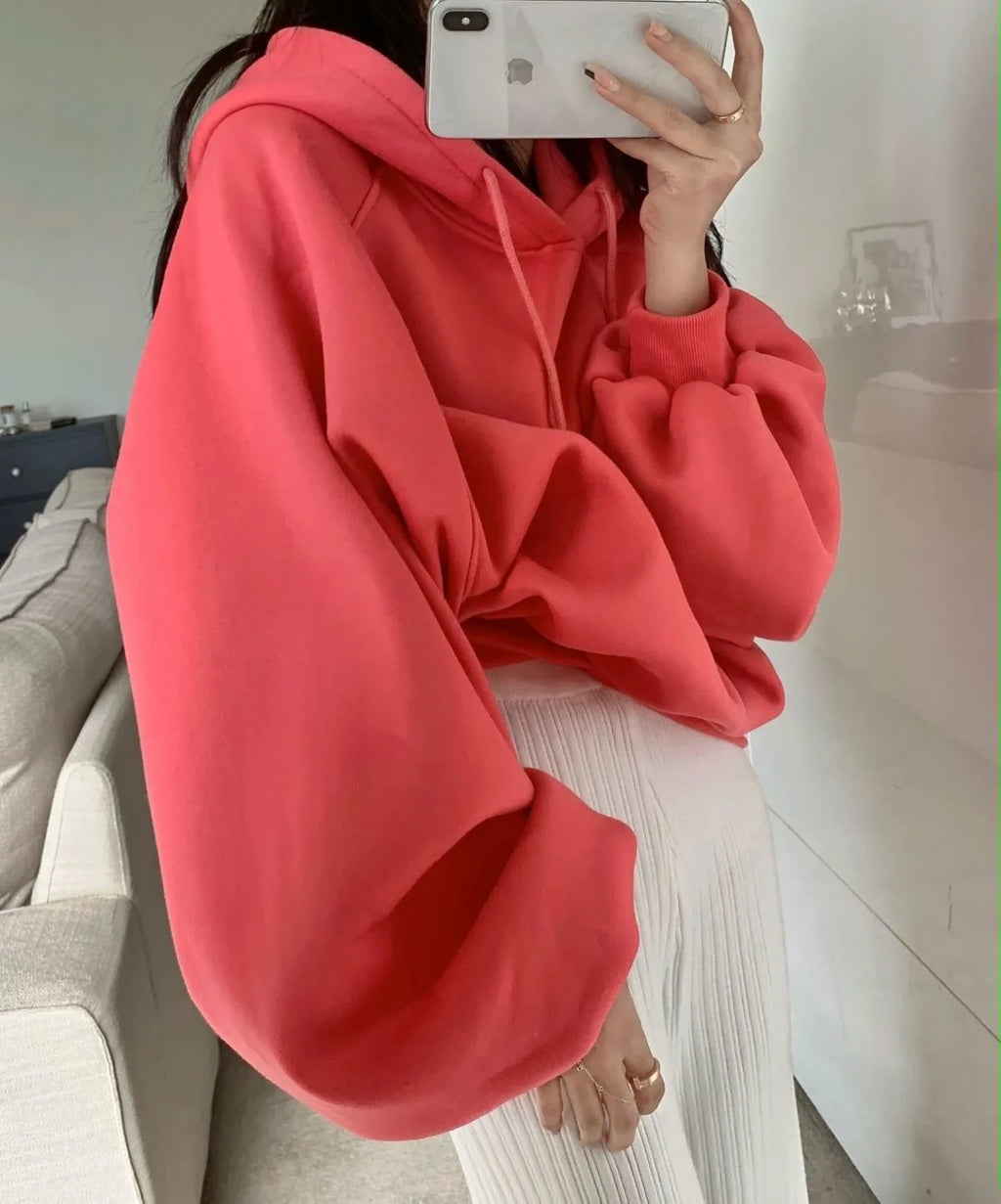 Watermelon red women's mulberry silk hooded sweater with sleeveless design on hanger