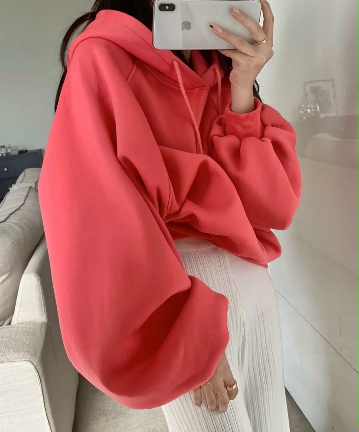 Watermelon red women's mulberry silk hooded sweater with sleeveless design on hanger