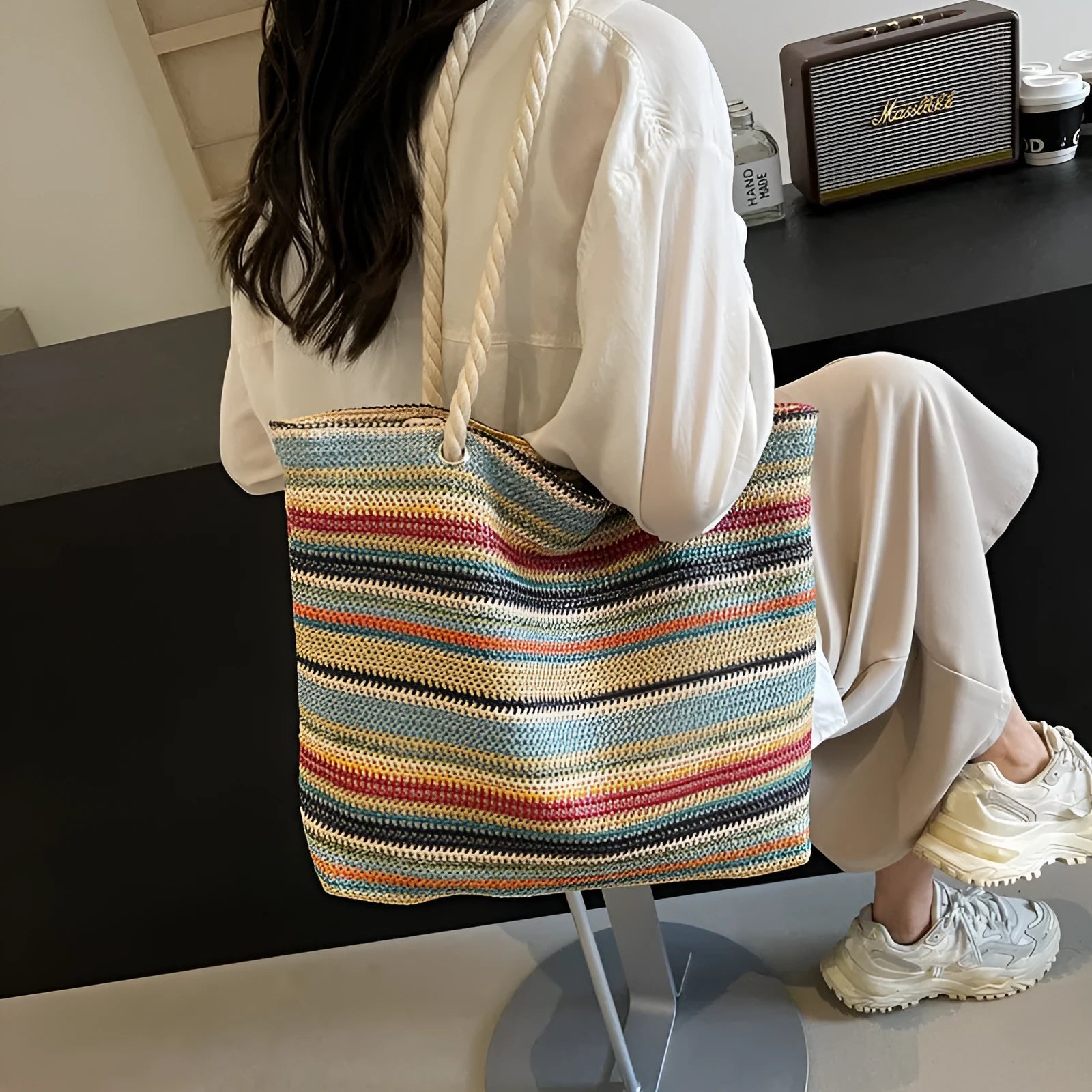 Blue woven nylon shoulder bag with large capacity and straw-style texture showing single-shoulder strap and polyester lining.