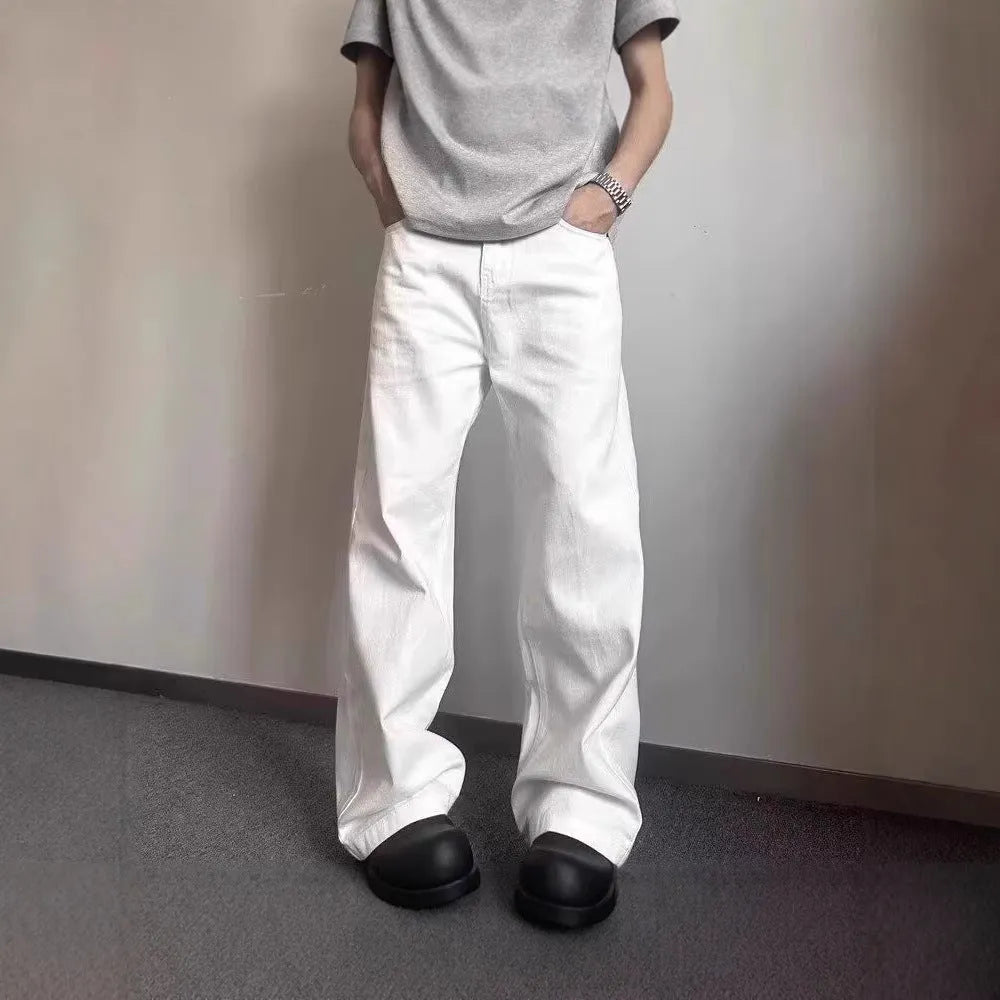 Men's white straight-leg wide-cut denim jeans on a plain background, showing front and side views.