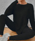 Black sunken stripe two-piece homewear set with pants and regular sleeve top on hanger
