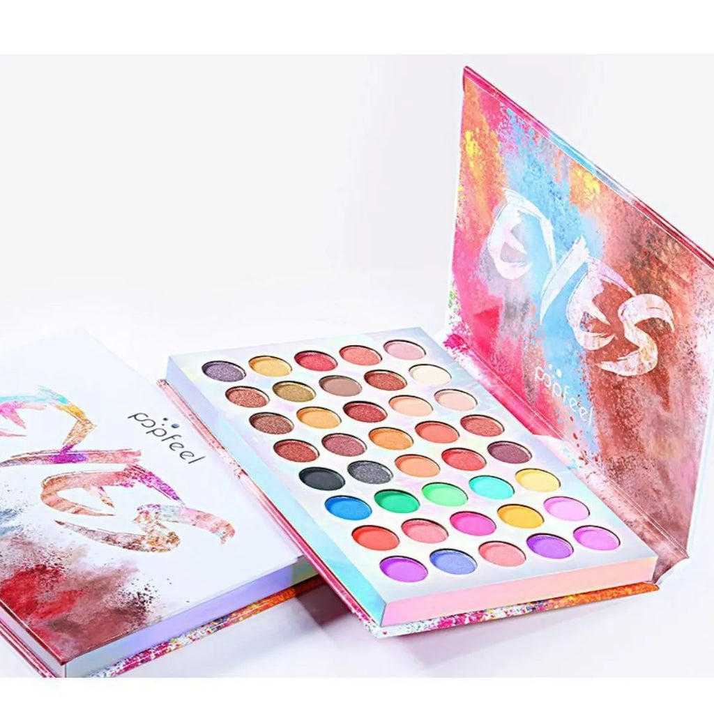Shimmer matte eye shadow palette with eight shades including purple, blue, black, sky blue, caramel, watermelon red, cameo brown, and peacock blue