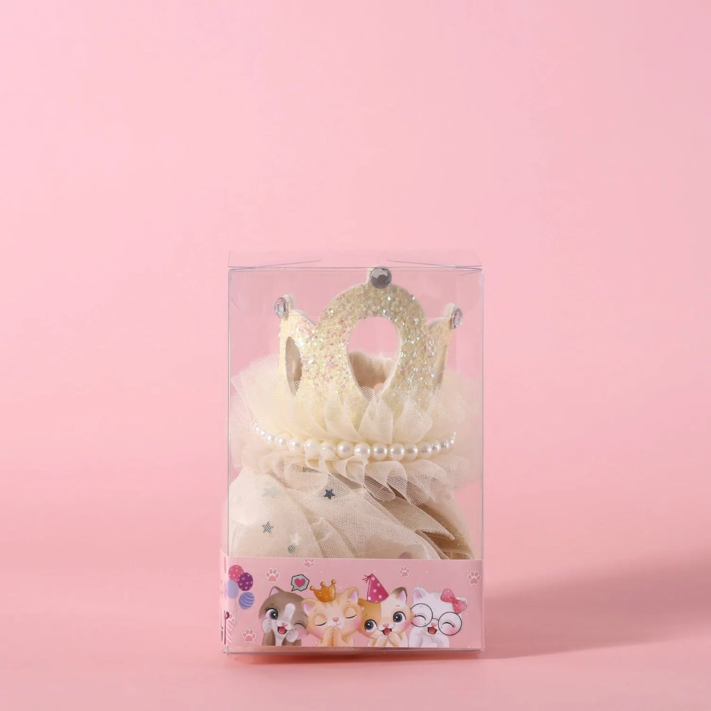 Beige and pink princess crown headdress with veil for cats on a plain background.