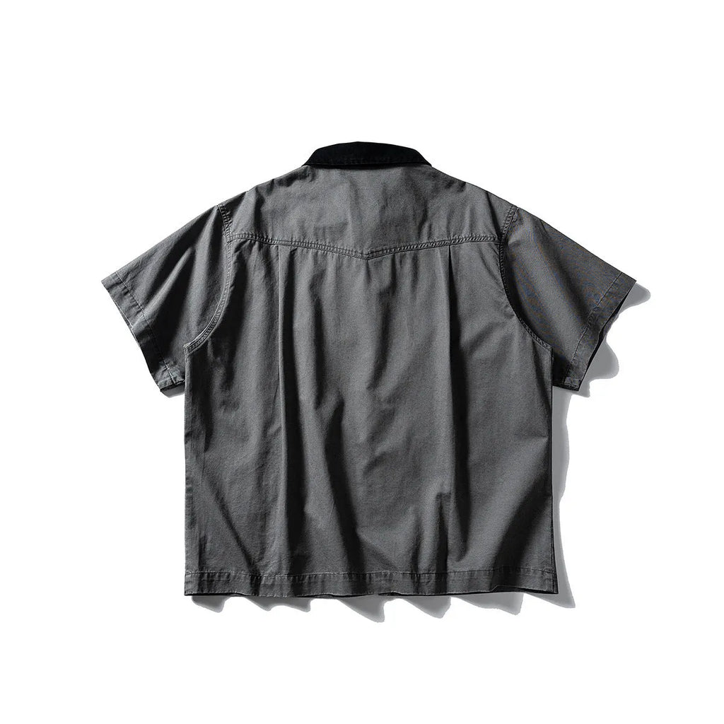 Man's loose-fitting khaki cotton overalls shirt with short sleeves, cardigan style