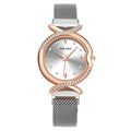 Ladies quartz watch with 32mm round dial, metal strap, magnetic buckle, and 24-hour indication in red, blue, black, silver, pink rose gold, or rose gold.