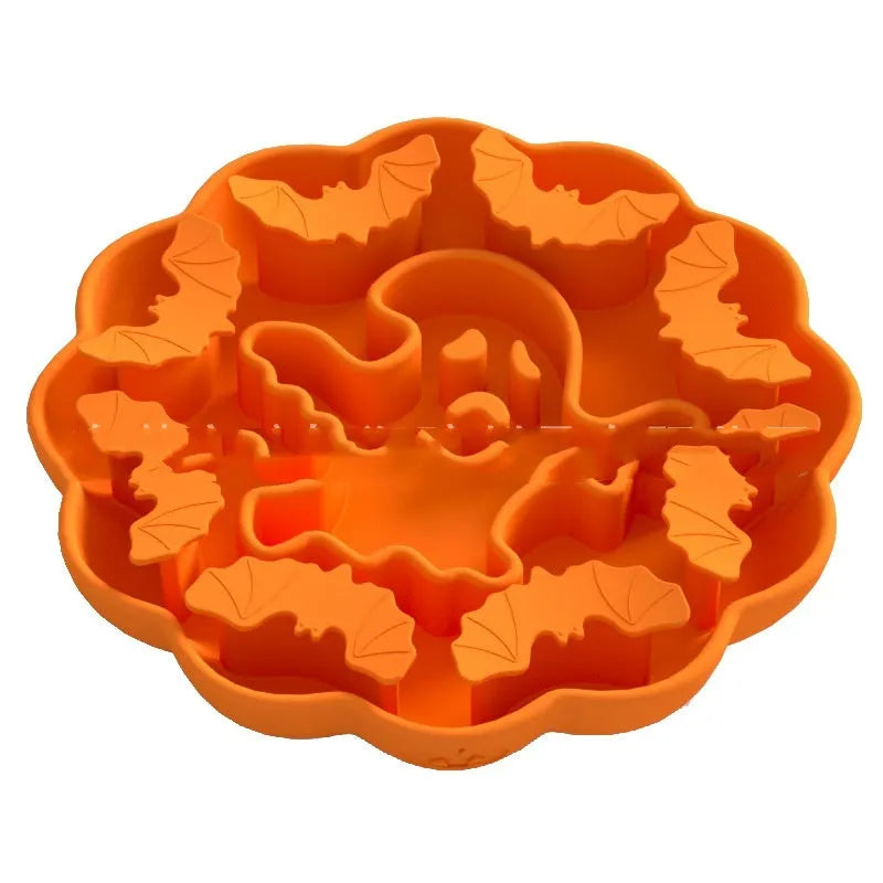 Edible silicon anti-choke slow feeding dog bowl in Halloween orange colour on floor