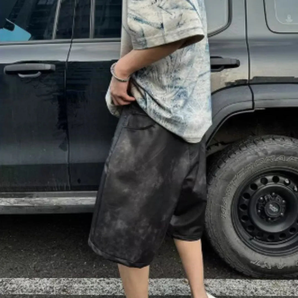 Korean style loose fit tie-dye printed t-shirt on a solid colour background.