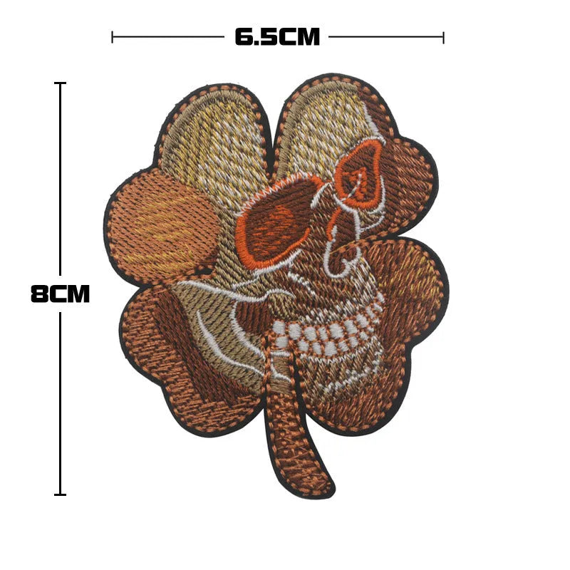 Outdoor embroidered fabric badge with Velcro strip showing clover design in green on nylon polyester material