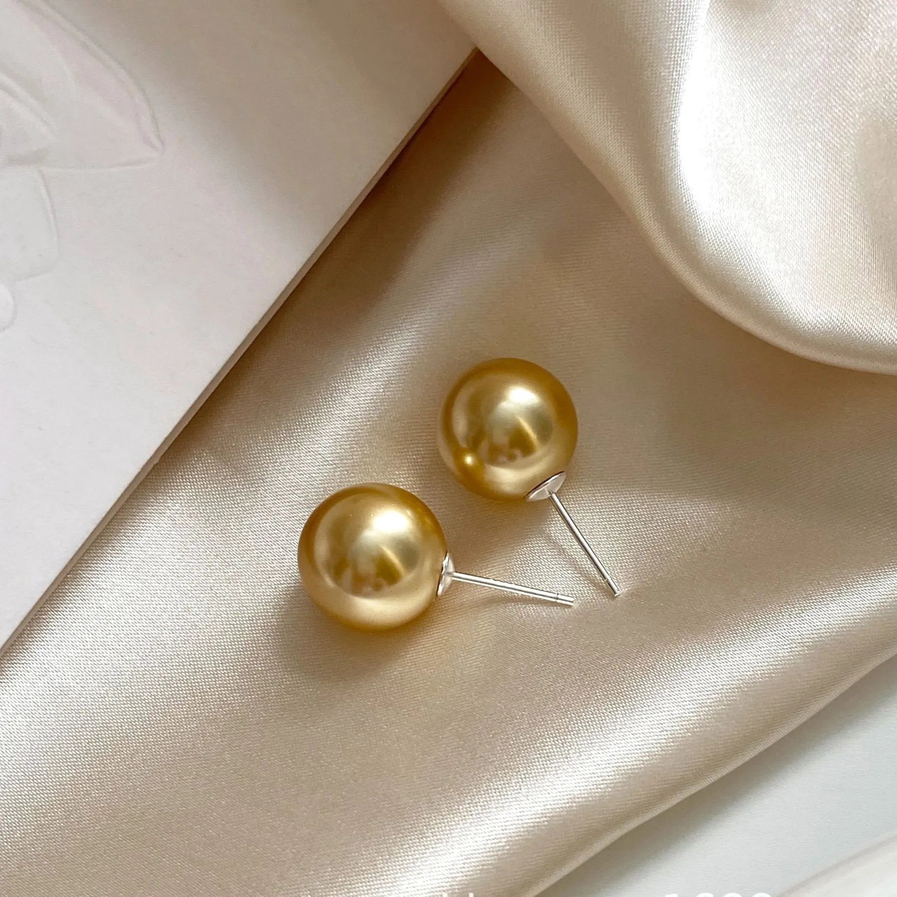 Large pearl stud earrings with eight awn star geometric design in 925 sterling silver showing 8mm to 14mm size options