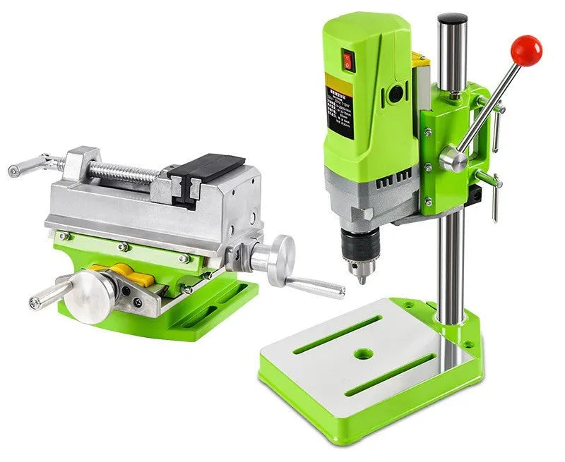 Bench drilling and milling machine with cross bench pliers and heavy duty bench pliers on a workshop table