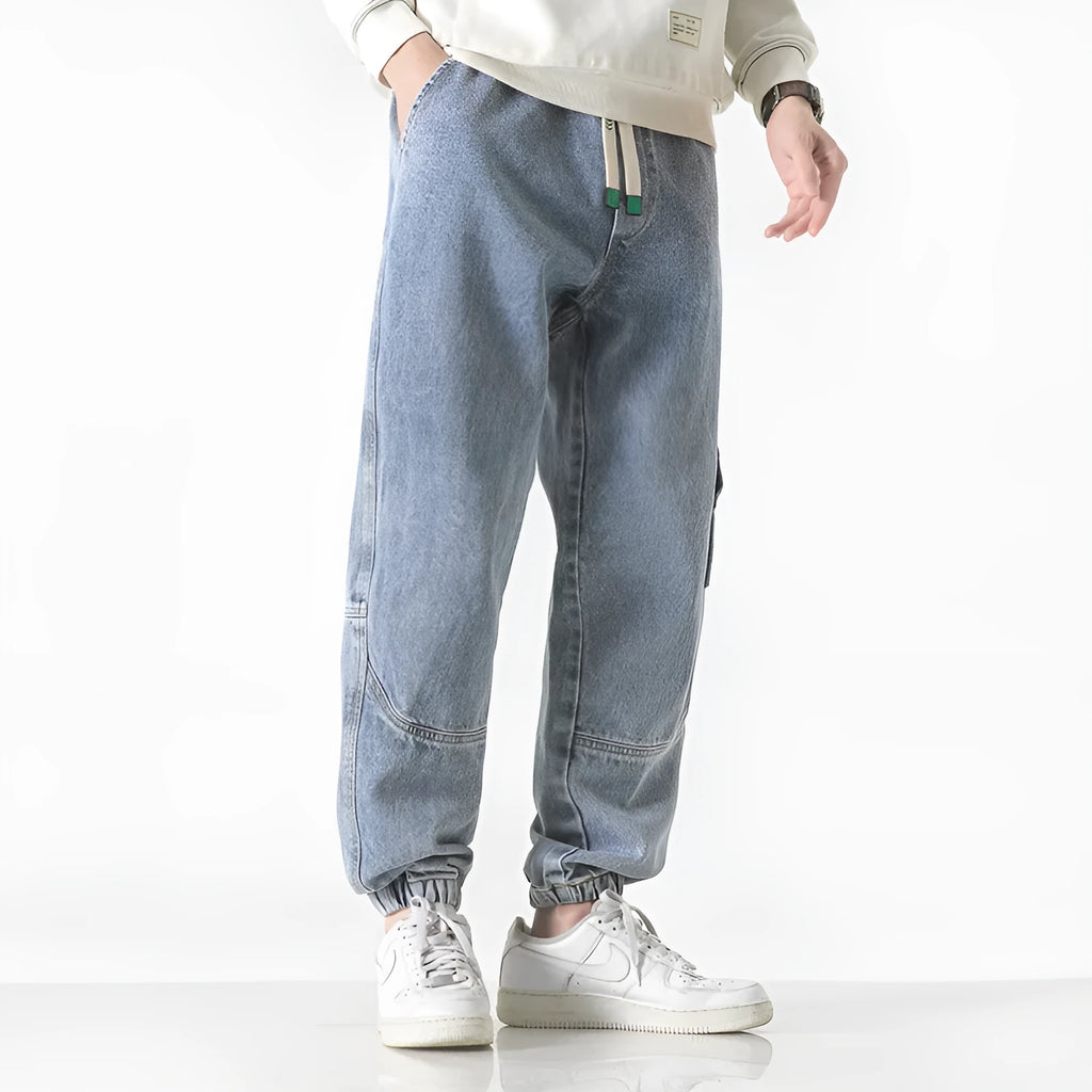 Men's cotton loose fit tapered trousers in black, blue, or grey colours with mid waist design