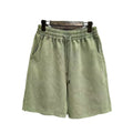 Men's cotton distressed casual shorts in loose straight-leg fit, shown in one of four solid colours.