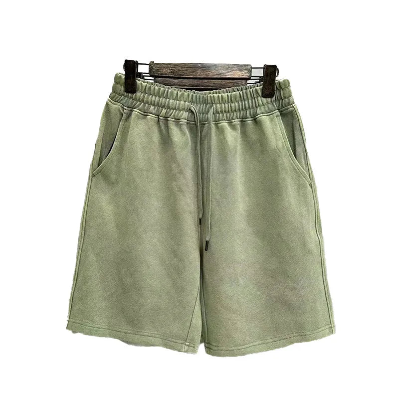 Men's cotton distressed casual shorts in loose straight-leg fit, shown in one of four solid colours.