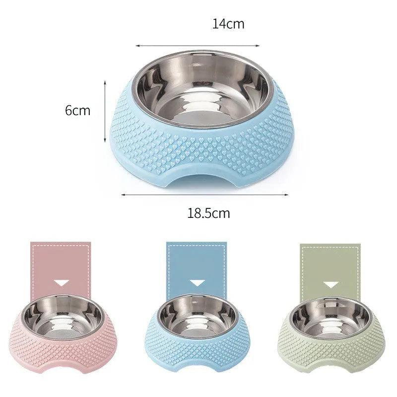 Set of four coloured stainless steel pet bowls with non-slip bases on a floor.
