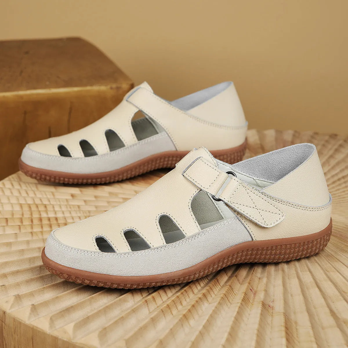 Plus size women's flat heel sandals with hollow breathable design and toe cap in white, red, and blue colours