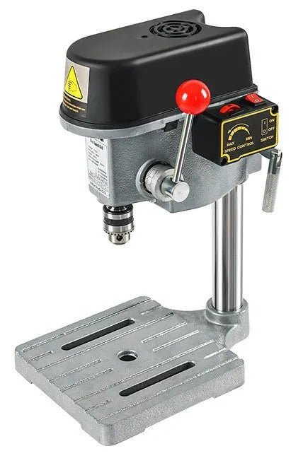 Bench drilling and milling machine with cross bench pliers and heavy duty bench pliers on a workshop table