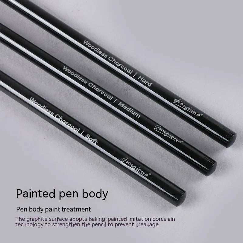 Carbonised and graphite drawing pencil set of nine in a wooden case, showing six graphite and three carbonised pencils.