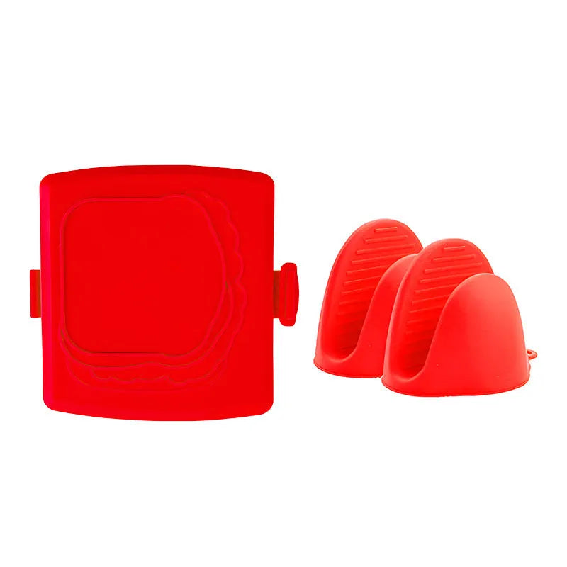 Red silicone baking tray with matching anti-scald gloves on kitchen counter