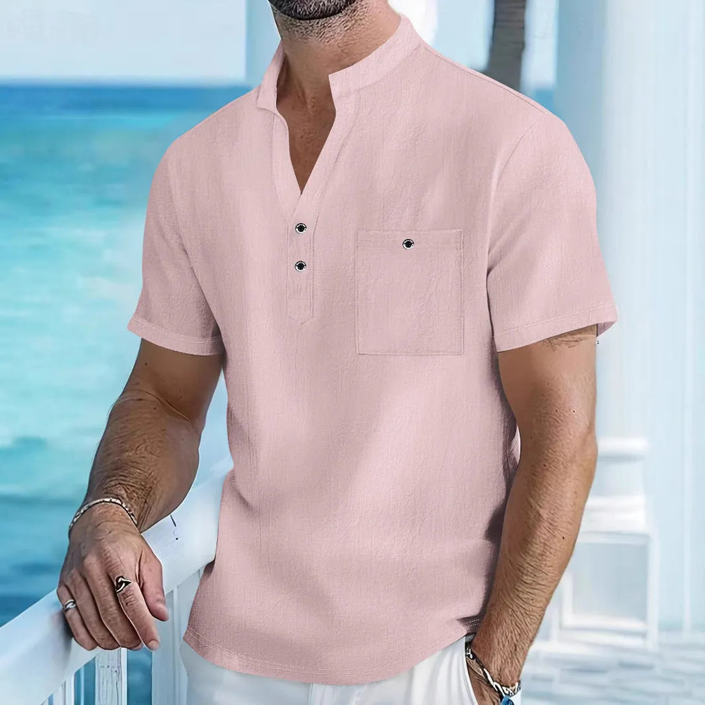 Men's light blue linen short sleeve shirt with a stand collar in a loose pullover fit.