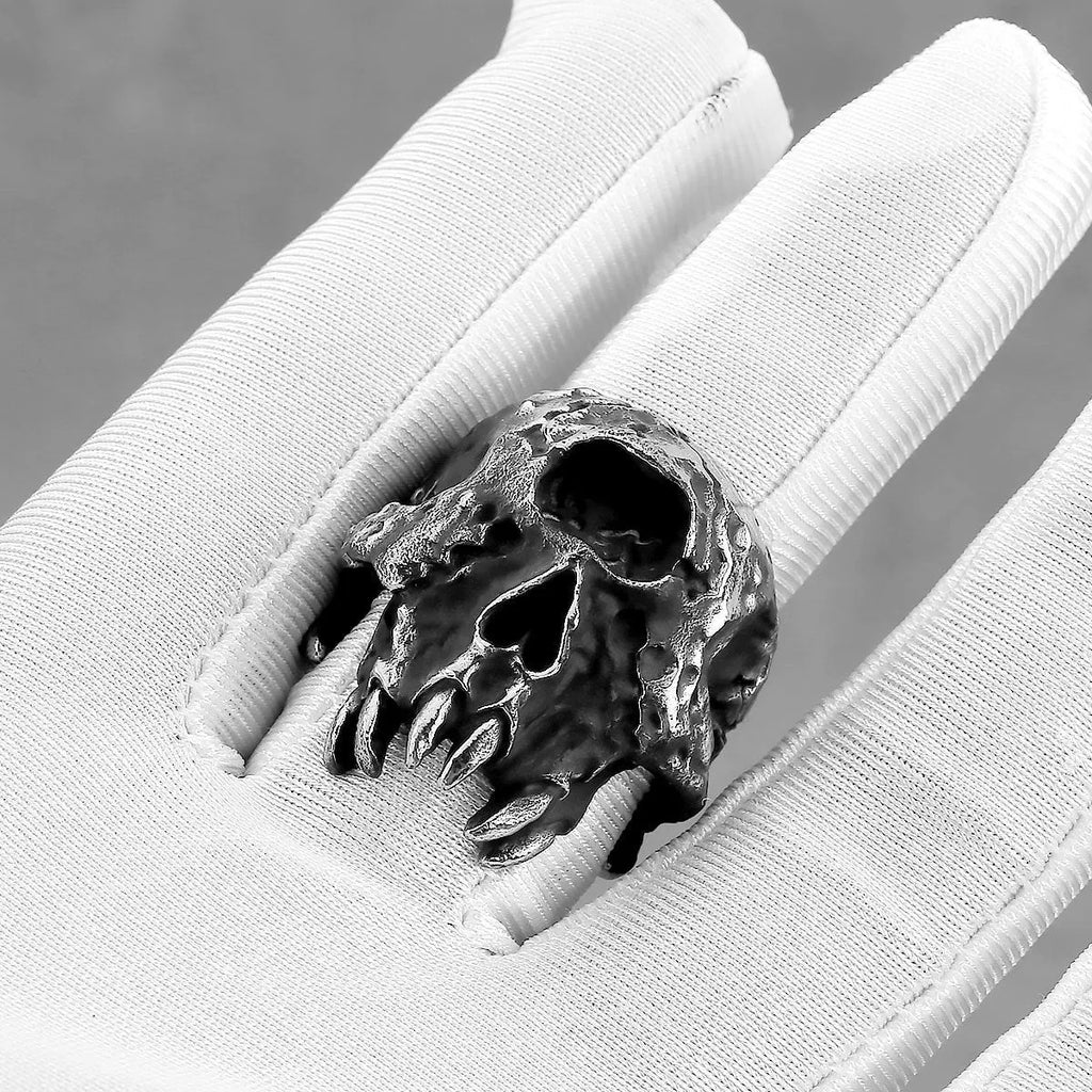 Alloy skull ring with one-eyed design in silver electroplated finish shown on finger