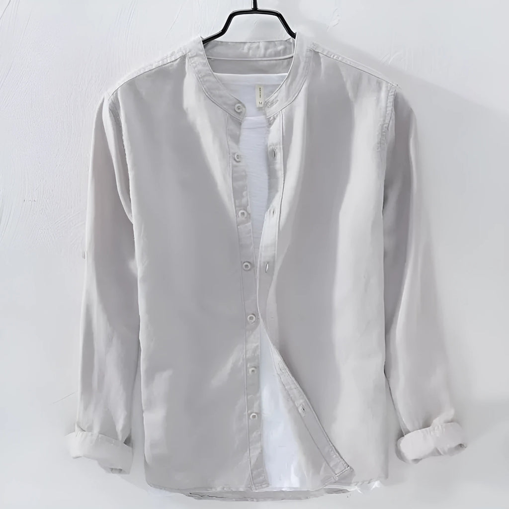 A man's loose fit long sleeve casual shirt in a cotton linen blend, shown in a solid colour.