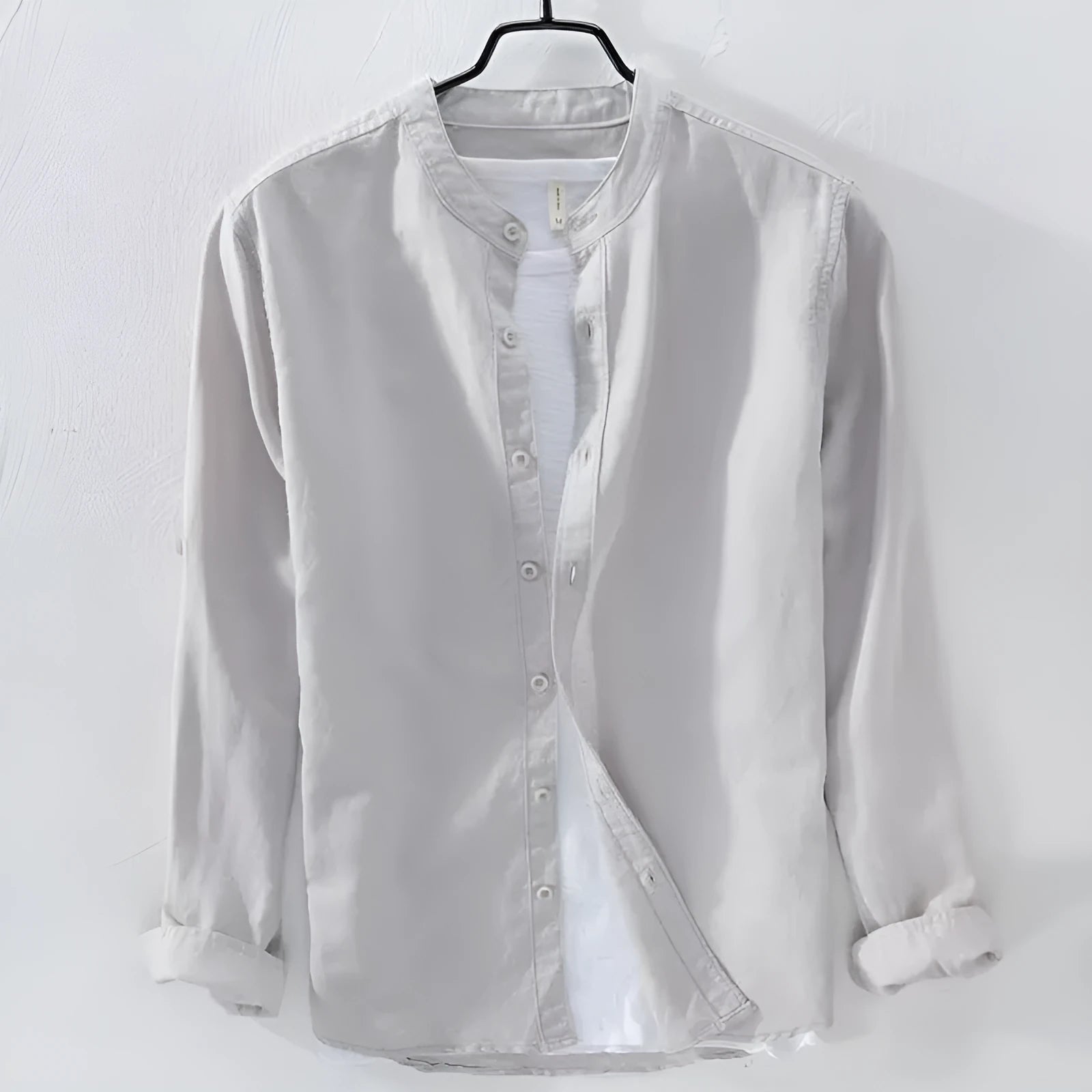 A man's loose fit long sleeve casual shirt in a cotton linen blend, shown in a solid colour.