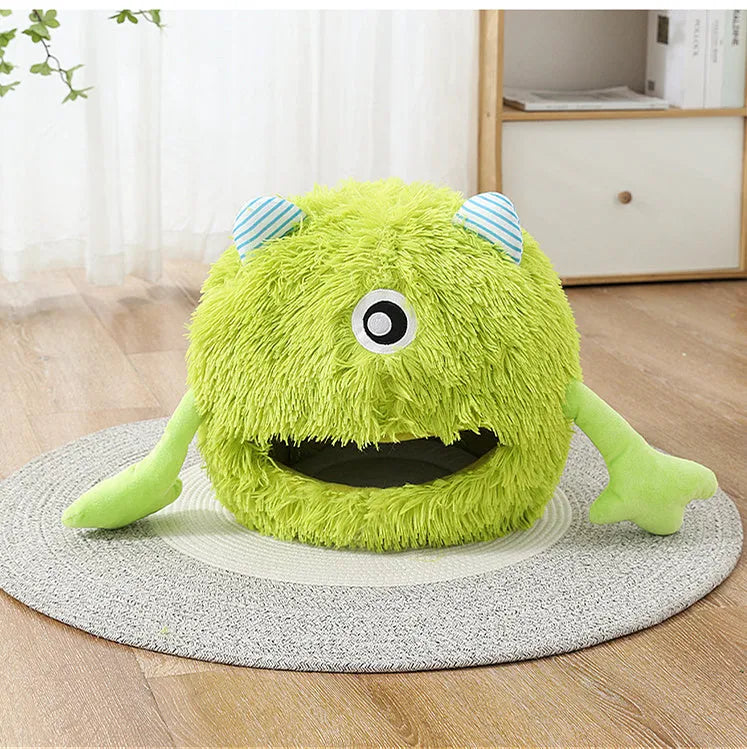 Fluffy round plush cat bed with a non-slip bottom, shown in grey.