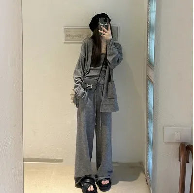Women's loose-fit knit cardigan, vest, and trousers three-piece set in wool blend fabric.