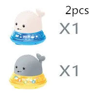 Automatic spray whale bath toy with LED lights floating in water