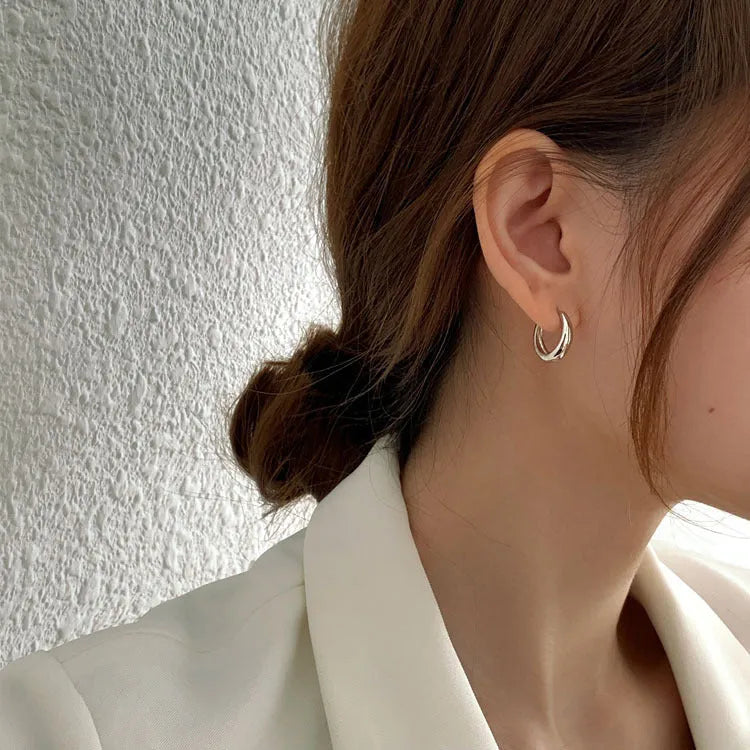 Women's geometric water drop earrings in gold and silver electroplated finishes showing minimalist retro design