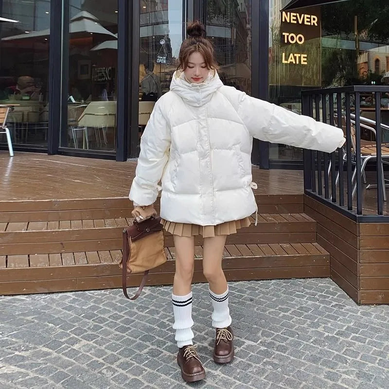 Women's milky white sleeveless insulated jacket with princess sleeves on a hanger