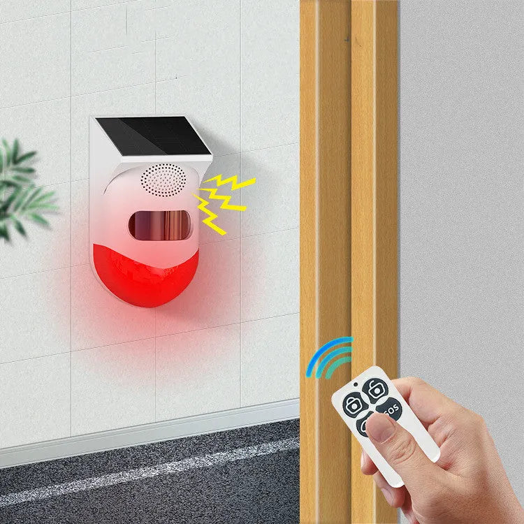 Solar-powered infrared security alarm with wall mount and detection range indicator