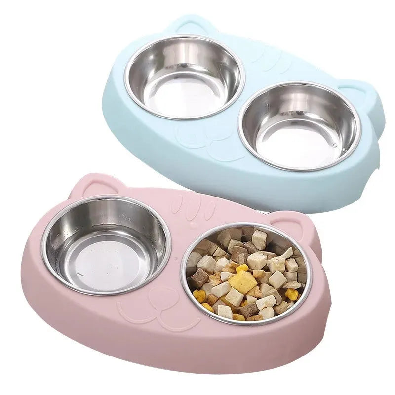 Blue Macaron double bowl plastic pet feeder for cats and dogs on a floor.