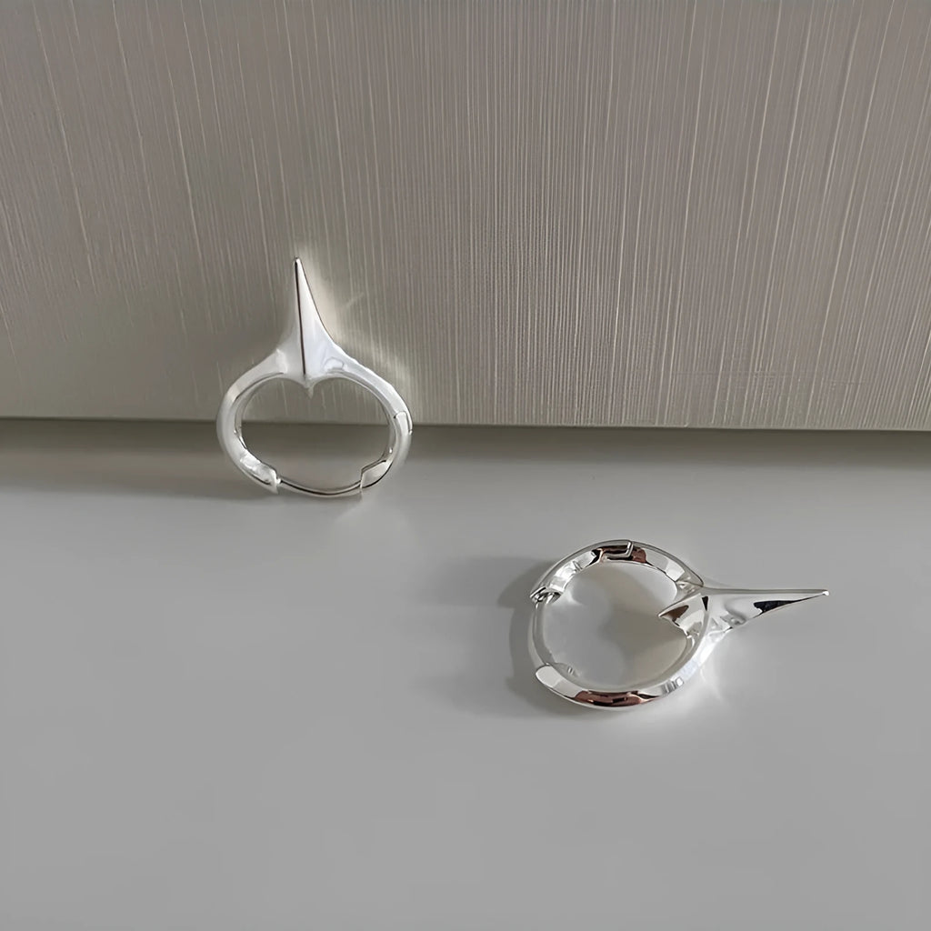 Platinum electroplated geometric star-shaped clip-on earrings for women.