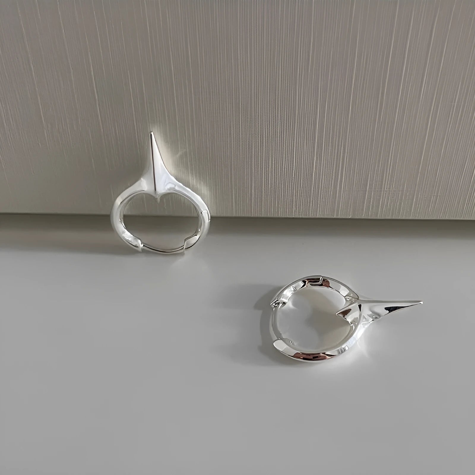 Platinum electroplated geometric star-shaped clip-on earrings for women.