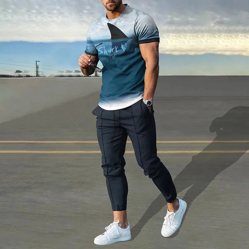 Man wearing a short sleeve printed pullover and matching trousers from a men's two-piece sports set.