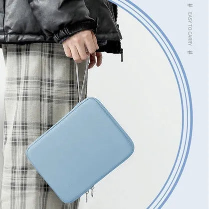 Imitation leather tablet protective case with a carry handle in light grey, shown next to a tablet.