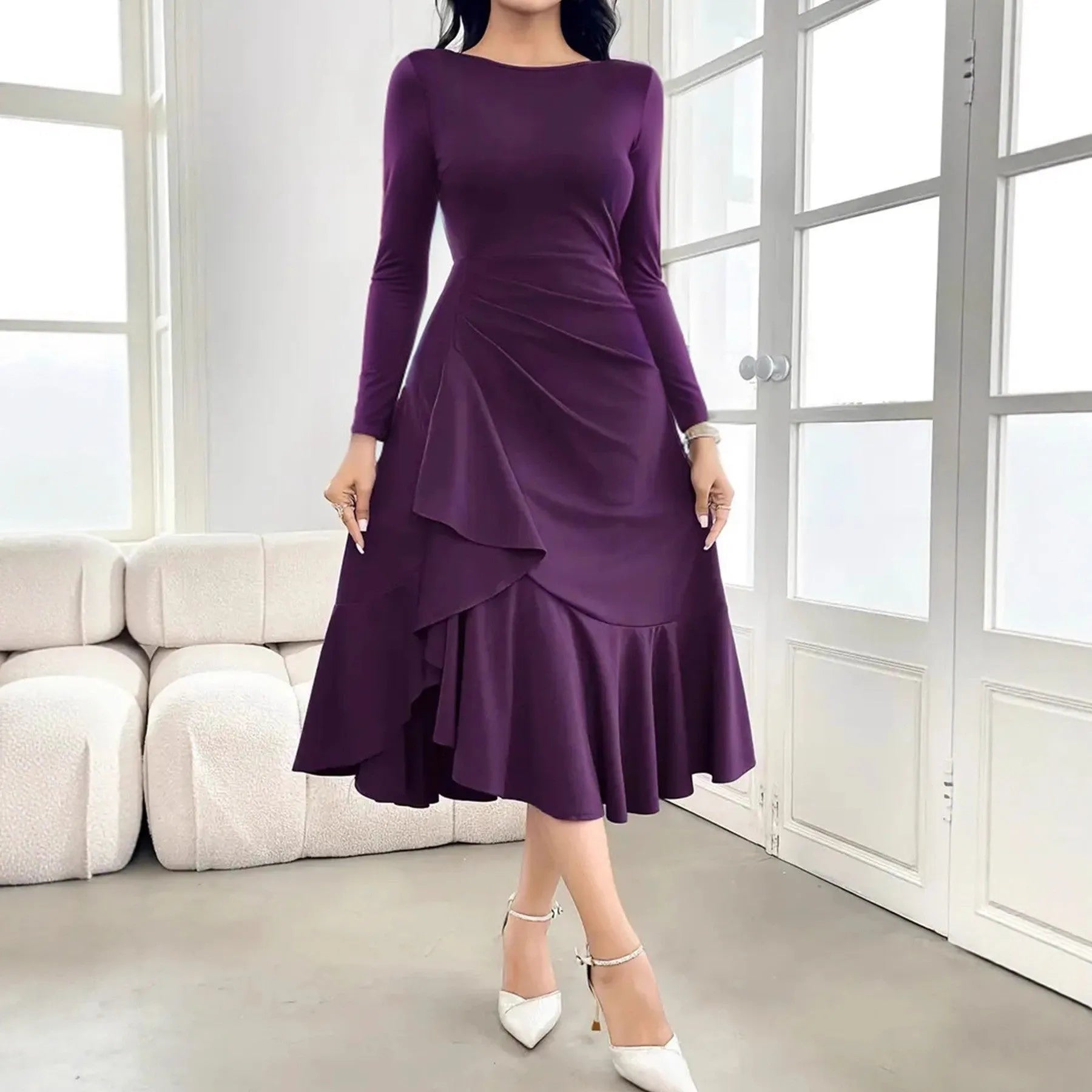 Purple women's long sleeve dress with ruffles and a round neck, shown on a mid-waist fit model.