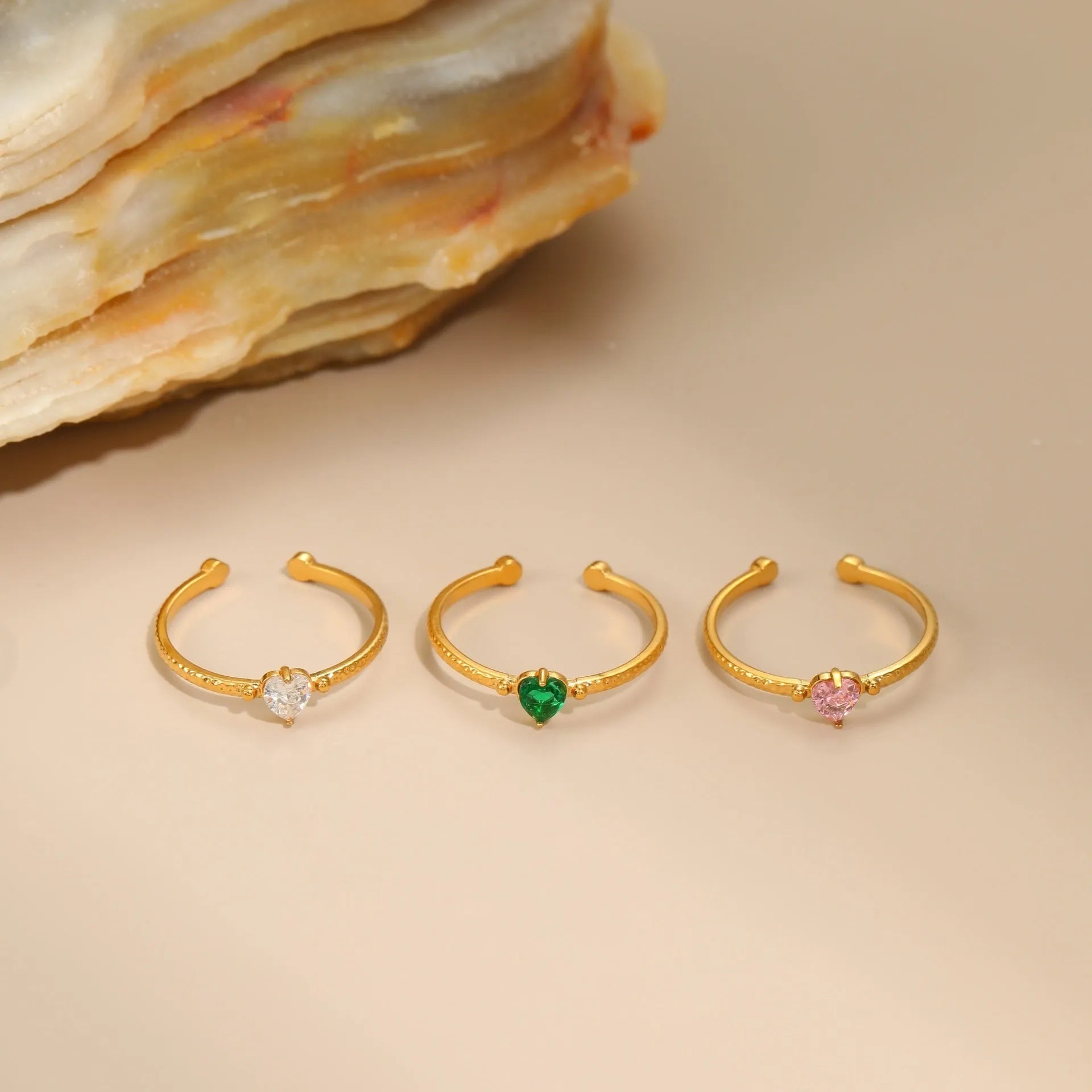 Open ended geometric heart shaped ring with inlaid zircon stones in stainless steel