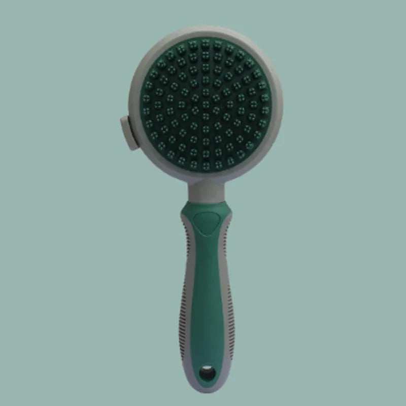 Green and pink 2-in-1 silicone cat grooming brush showing slicker brush and massager sides