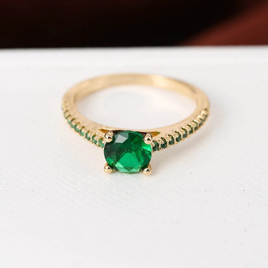 Geometric hexagon zircon fashion ring in electroplated copper on a hand, showing gold and gun black colour options.