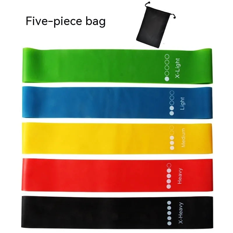 Five yoga stretching bands in different colours showing graduated thickness for progressive resistance training
