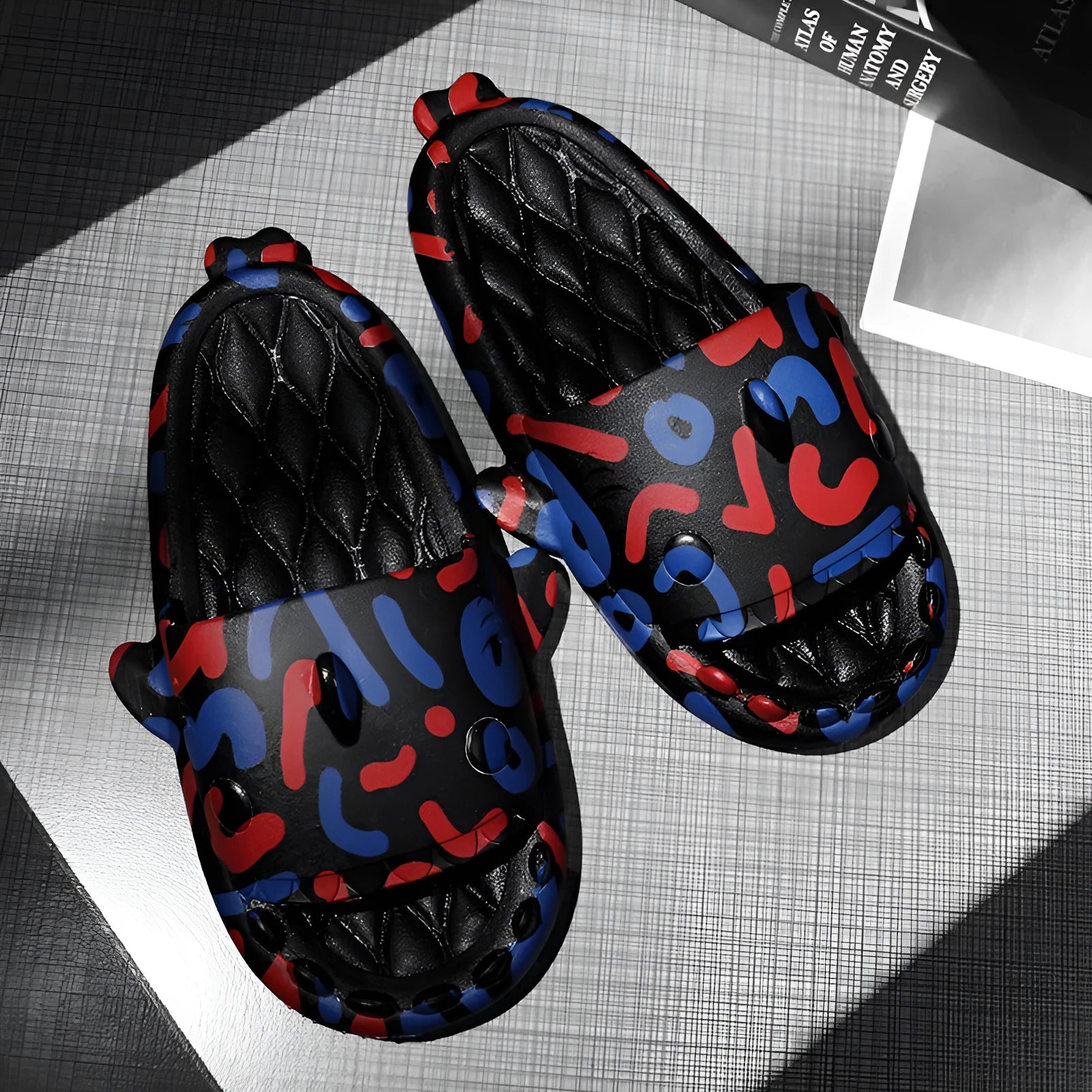 Casual shark design home slippers in EVA material on a plain background.