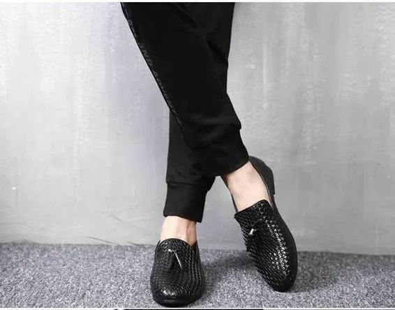Anyaman men's woven loafers in black with soft sole, side view showing handcrafted weave texture